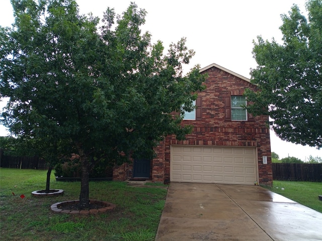 11540 Arbroath Ln, Austin, TX 78754 - view of front of home featuring driveway, brick siding, and an attached garage