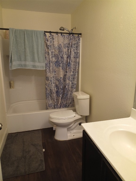 11540 Arbroath Ln, Austin, TX 78754 - full bath with vanity, wood finished floors, and shower / bath combo with shower curtain