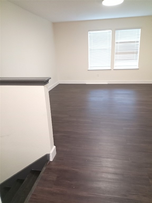 11540 Arbroath Ln, Austin, TX 78754 - unfurnished room with baseboards and dark wood finished floors