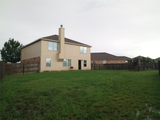 11540 Arbroath Ln, Austin, TX 78754 - back of property with a chimney and a fenced backyard