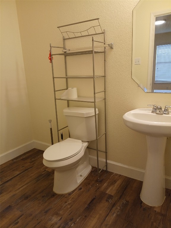11540 Arbroath Ln, Austin, TX 78754 - half bathroom with wood finished floors and toilet