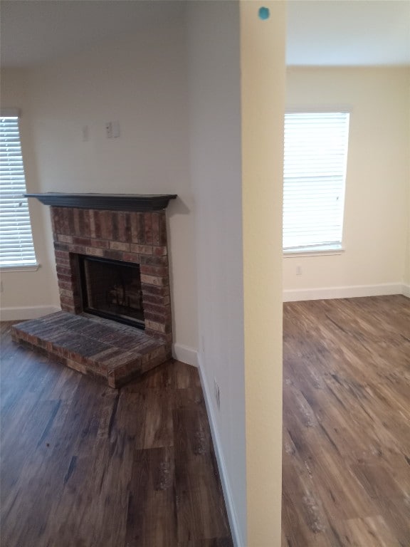 11540 Arbroath Ln, Austin, TX 78754 - unfurnished living room featuring wood finished floors and a fireplace