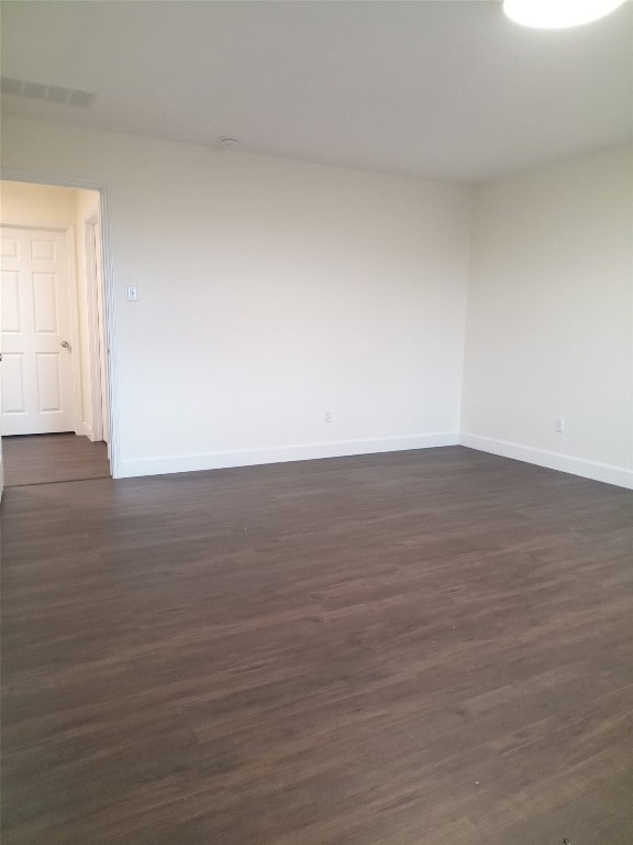 11540 Arbroath Ln, Austin, TX 78754 - spare room with baseboards and dark wood-type flooring