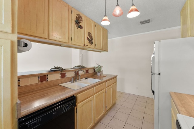 2014 Stagecoach Trl, Temple, TX 76502 - kitchen featuring black dishwasher, freestanding refrigerator, light brown cabinetry, light tile patterned floors, and decorative light fixtures