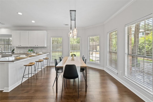 11235 Tracton Ln, Austin, TX 78739 - dining space featuring ornamental molding, dark wood-style floors, and recessed lighting