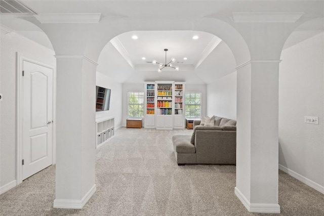 11235 Tracton Ln, Austin, TX 78739 - carpeted living area with arched walkways, ornamental molding, a chandelier, recessed lighting, and decorative columns