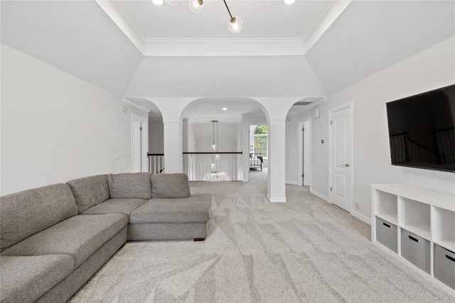 11235 Tracton Ln, Austin, TX 78739 - living room featuring decorative columns, arched walkways, light colored carpet, and crown molding
