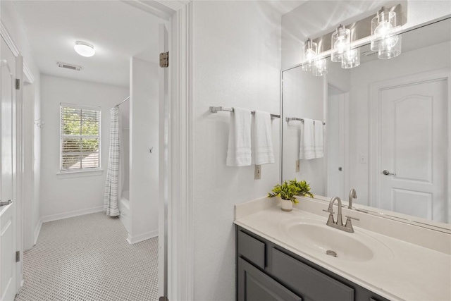 11235 Tracton Ln, Austin, TX 78739 - full bath featuring vanity, a chandelier, shower / bath combo, and tile patterned floors
