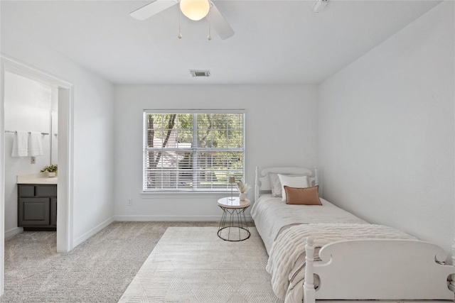 11235 Tracton Ln, Austin, TX 78739 - bedroom featuring light colored carpet, connected bathroom, and ceiling fan