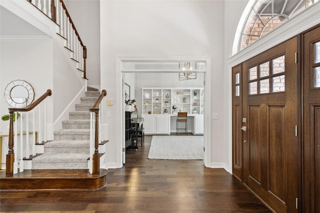 11235 Tracton Ln, Austin, TX 78739 - entrance foyer with a high ceiling, stairway, and dark wood finished floors