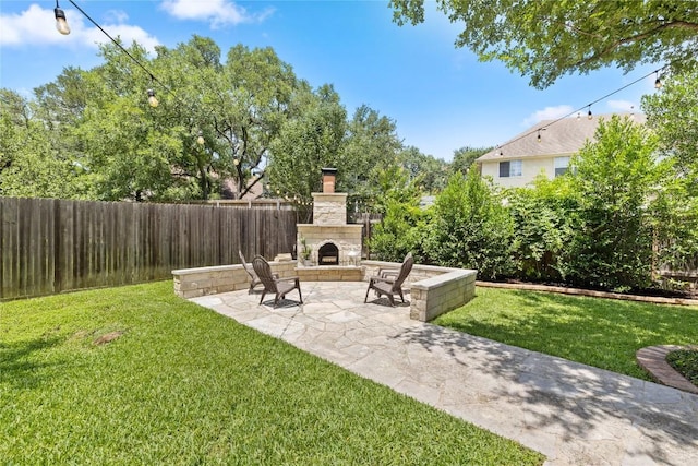 11235 Tracton Ln, Austin, TX 78739 - view of yard with an outdoor stone fireplace and a patio area