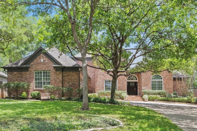 11235 Tracton Ln, Austin, TX 78739 - view of front of home with a front lawn and brick siding