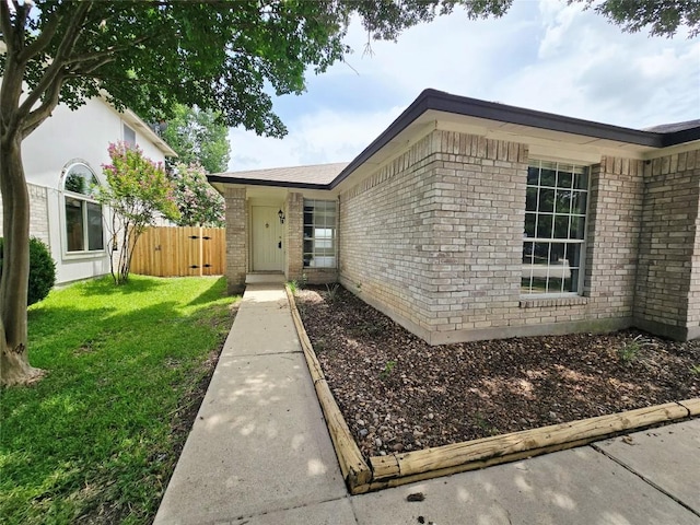 707 Johnny Bench, Round Rock, TX 78665 - view of exterior entry with brick siding and a gate