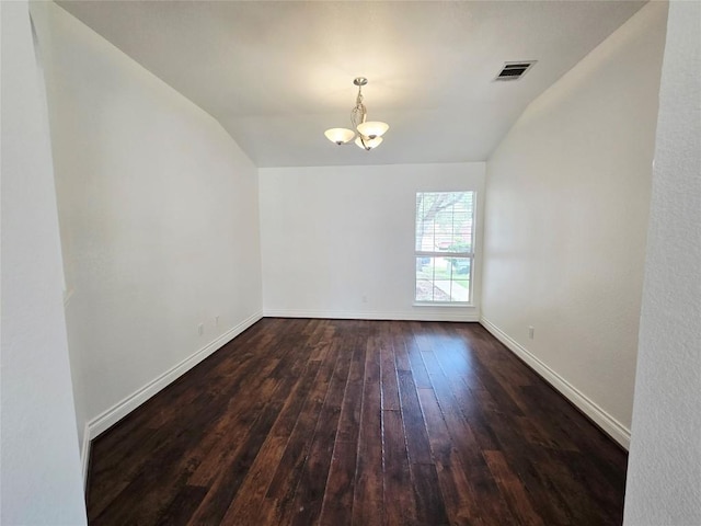 707 Johnny Bench, Round Rock, TX 78665 - unfurnished room featuring vaulted ceiling, a chandelier, and dark wood-type flooring