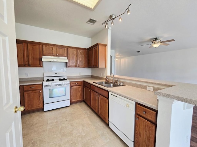 707 Johnny Bench, Round Rock, TX 78665 - kitchen with white appliances, under cabinet range hood, a peninsula, light countertops, and a ceiling fan