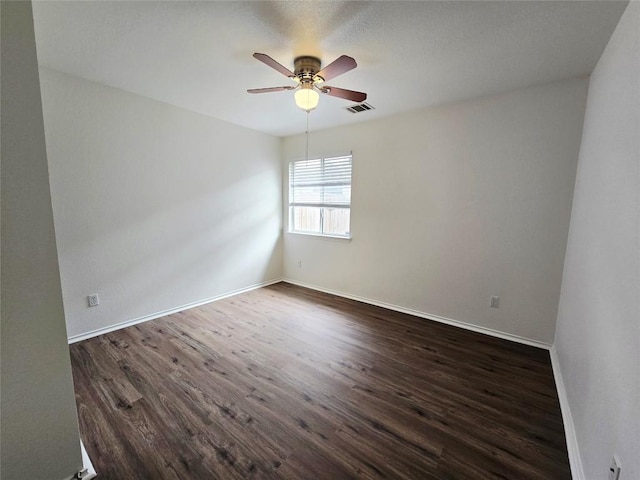 707 Johnny Bench, Round Rock, TX 78665 - unfurnished room with dark wood finished floors and ceiling fan