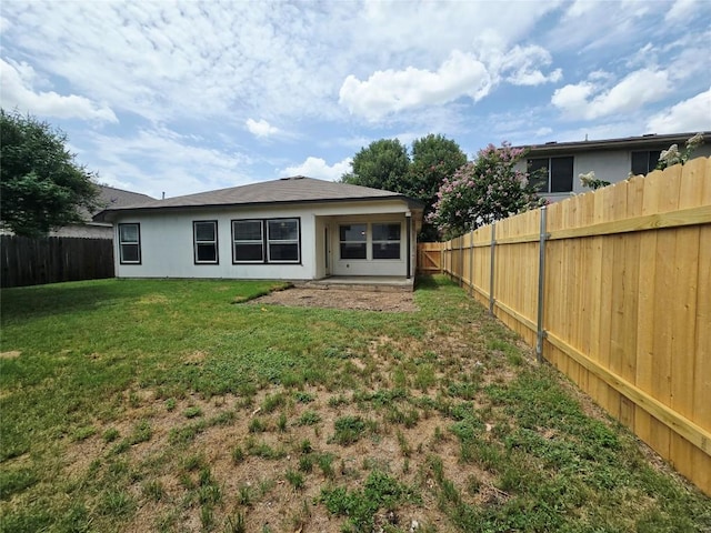 707 Johnny Bench, Round Rock, TX 78665 - back of house with a fenced backyard and stucco siding
