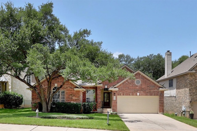 403 Warm Breeze Cv, Austin, TX 78717 - view of front of house with a garage, a front lawn, driveway, and brick siding
