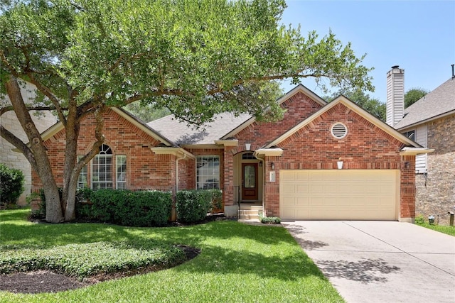 403 Warm Breeze Cv, Austin, TX 78717 - view of front of property featuring a front yard, driveway, an attached garage, and brick siding