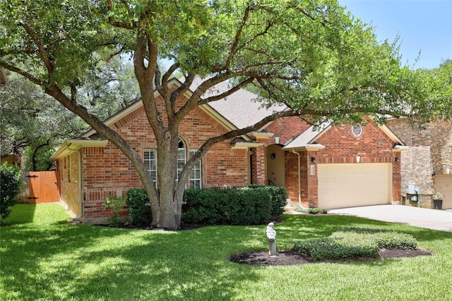 403 Warm Breeze Cv, Austin, TX 78717 - view of front of property featuring a garage, a front lawn, concrete driveway, and brick siding