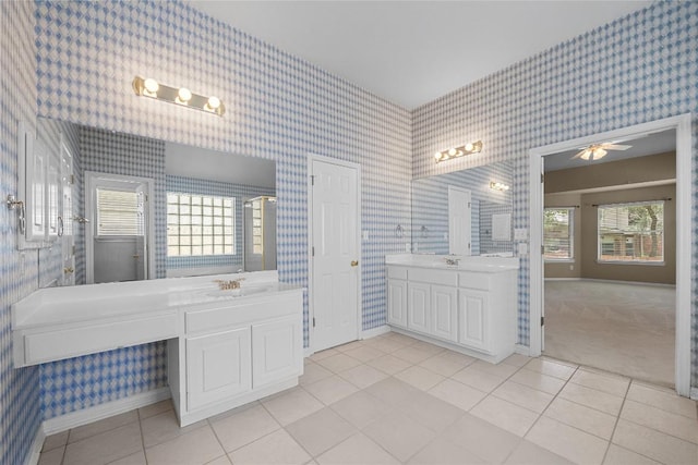 403 Warm Breeze Cv, Austin, TX 78717 - bathroom featuring wallpapered walls, two vanities, tile patterned floors, and ceiling fan