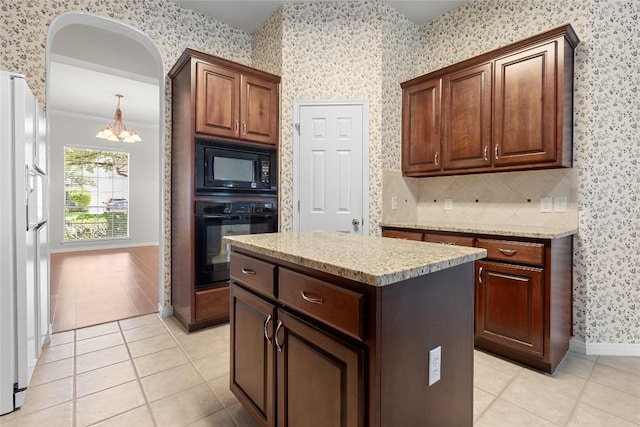 403 Warm Breeze Cv, Austin, TX 78717 - kitchen with black appliances, wallpapered walls, a chandelier, light tile patterned flooring, and a kitchen island