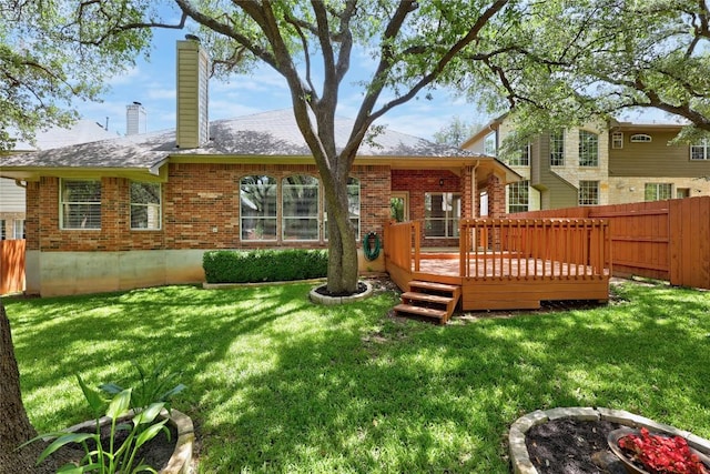 403 Warm Breeze Cv, Austin, TX 78717 - rear view of house featuring brick siding, a fenced backyard, a chimney, and a wooden deck