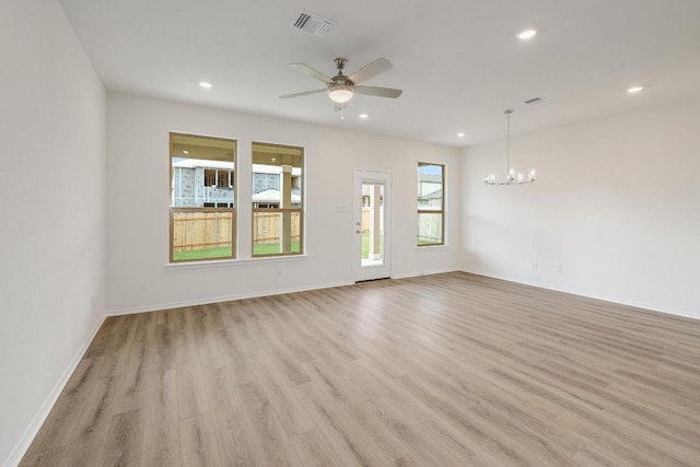4935 Mozzafiato Ln, Round Rock, TX 78665 - unfurnished living room with a chandelier, light wood-style flooring, recessed lighting, and ceiling fan