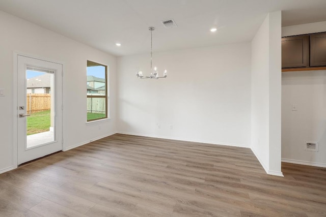 4935 Mozzafiato Ln, Round Rock, TX 78665 - unfurnished dining area with a chandelier, light wood-style flooring, and recessed lighting