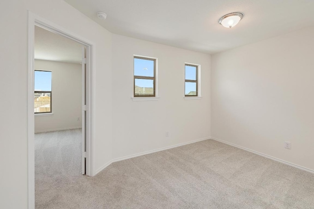 4935 Mozzafiato Ln, Round Rock, TX 78665 - spare room with carpet, healthy amount of natural light, and a smoke detector