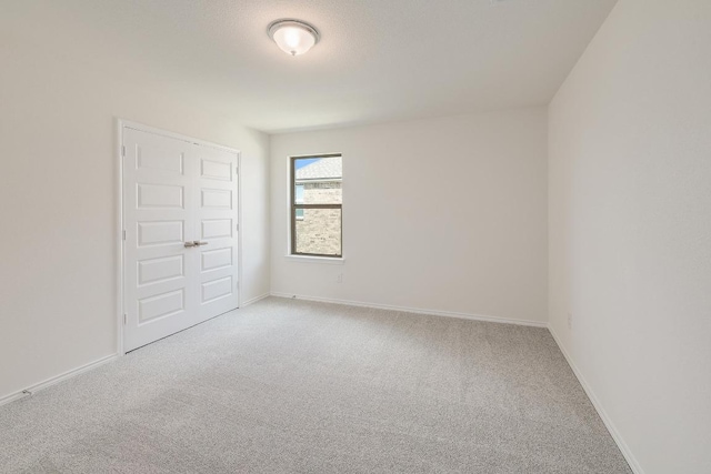4935 Mozzafiato Ln, Round Rock, TX 78665 - unfurnished bedroom featuring light colored carpet and baseboards