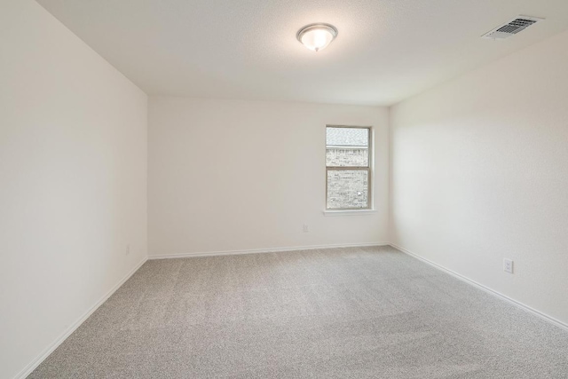 4935 Mozzafiato Ln, Round Rock, TX 78665 - spare room featuring light colored carpet and baseboards