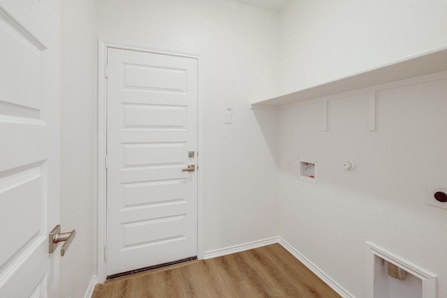 4935 Mozzafiato Ln, Round Rock, TX 78665 - washroom with gas dryer hookup, washer hookup, light wood-style flooring, and electric dryer hookup