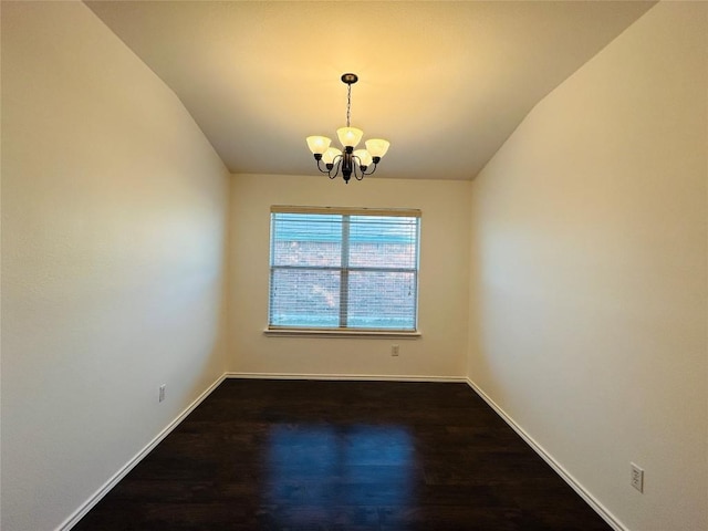 600 Mccarthur Dr, Leander, TX 78641 - spare room featuring a chandelier, lofted ceiling, and wood finished floors