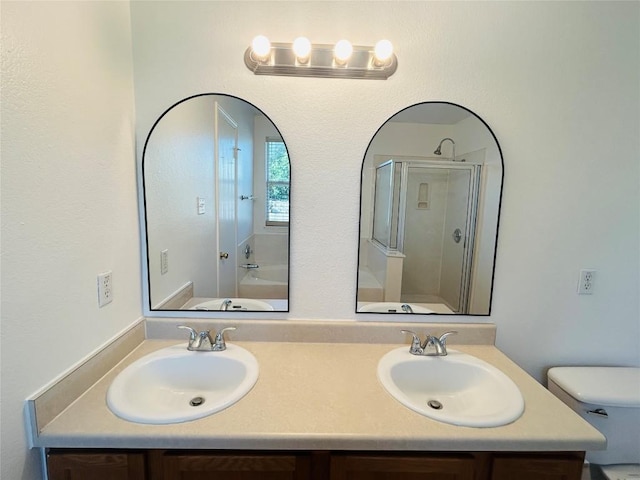 600 Mccarthur Dr, Leander, TX 78641 - bathroom with double vanity and a shower with door