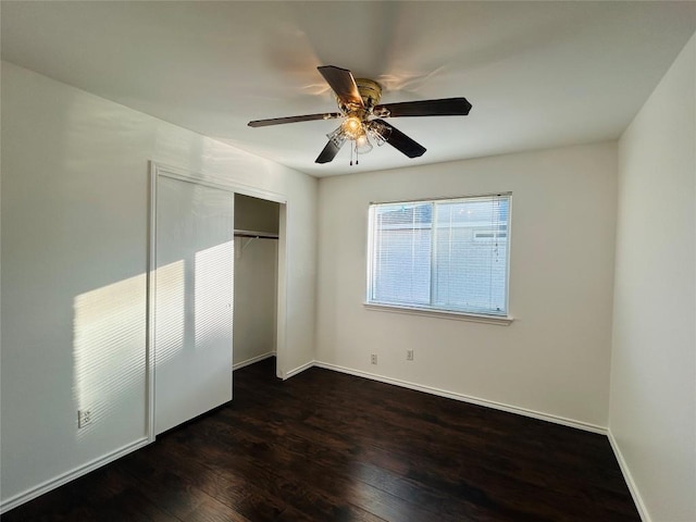 600 Mccarthur Dr, Leander, TX 78641 - unfurnished bedroom featuring dark wood-style flooring, a closet, and a ceiling fan