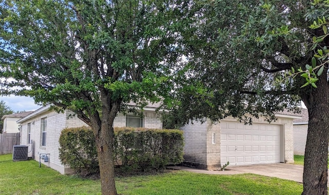 600 Mccarthur Dr, Leander, TX 78641 - view of front of home with brick siding, concrete driveway, and a front yard