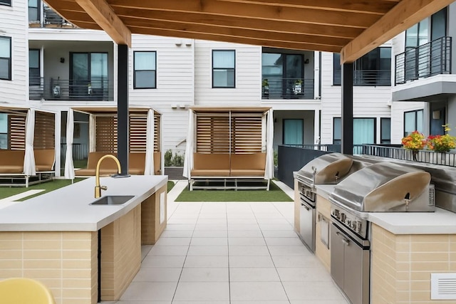 1701 Simond Ave Unit 305, Austin, TX 78723 - view of patio / terrace featuring a sink and exterior kitchen