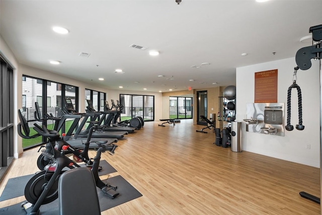 1701 Simond Ave Unit 305, Austin, TX 78723 - gym with light wood-type flooring and recessed lighting