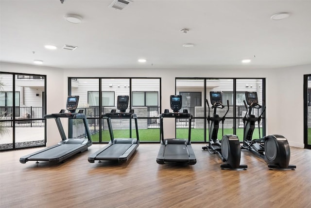 1701 Simond Ave Unit 305, Austin, TX 78723 - workout area with wood finished floors and recessed lighting