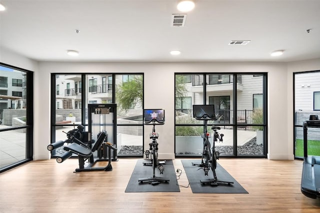1701 Simond Ave Unit 305, Austin, TX 78723 - gym with wood finished floors and recessed lighting