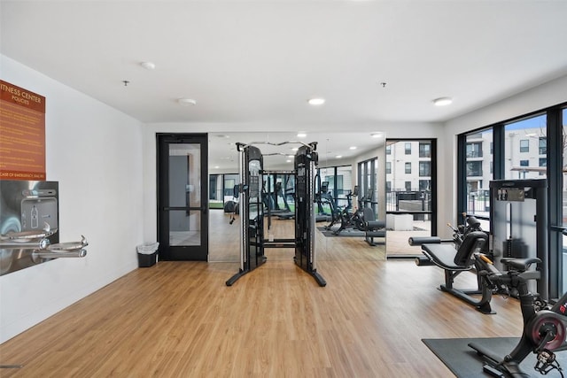 1701 Simond Ave Unit 305, Austin, TX 78723 - exercise room featuring light wood finished floors and recessed lighting