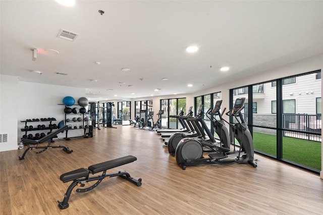 1701 Simond Ave Unit 305, Austin, TX 78723 - exercise room with light wood-style flooring and recessed lighting