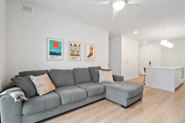 1701 Simond Ave Unit 305, Austin, TX 78723 - living area with light wood-type flooring, ceiling fan, and recessed lighting