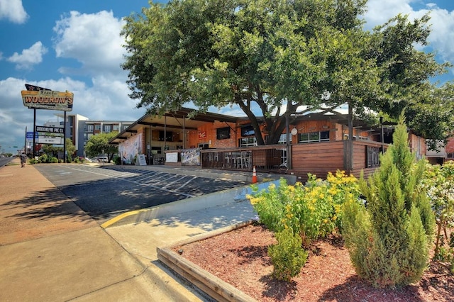 2613 Geraghty Ave, Austin, TX 78757 - view of front of property featuring uncovered parking and a porch