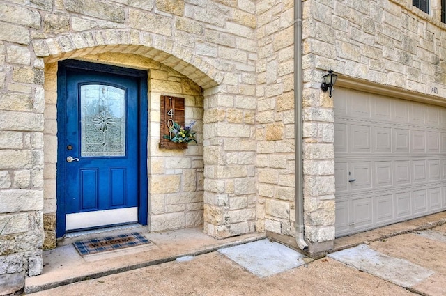 1401 Balsam Way, Round Rock, TX 78665 - property entrance with stone siding and a garage