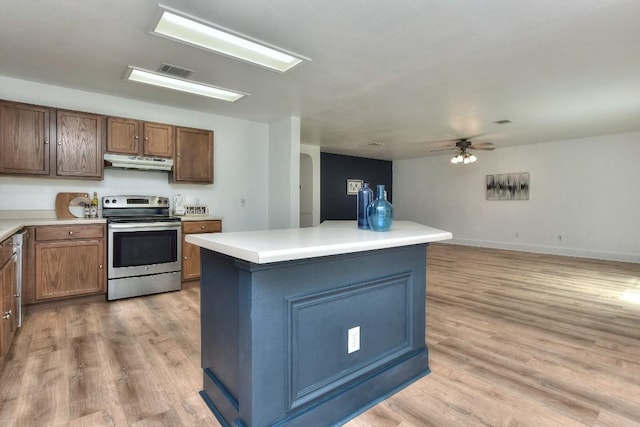 1401 Balsam Way, Round Rock, TX 78665 - kitchen with electric stove, exhaust hood, ceiling fan, light wood-style flooring, and light countertops