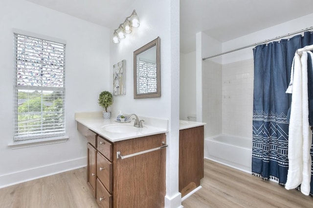1401 Balsam Way, Round Rock, TX 78665 - full bath with wood finished floors, vanity, and shower / bath combo with shower curtain