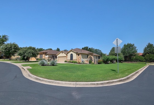 102 Rivulet Ln, Austin, TX 78738 - ranch-style house featuring an attached garage, a front yard, driveway, and stucco siding