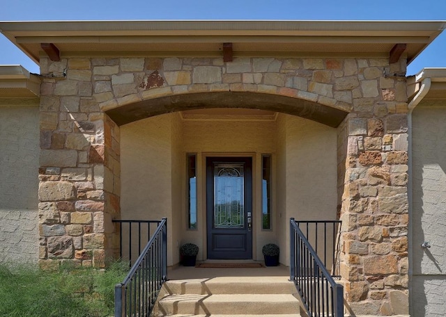 102 Rivulet Ln, Austin, TX 78738 - doorway to property featuring stone siding and stucco siding